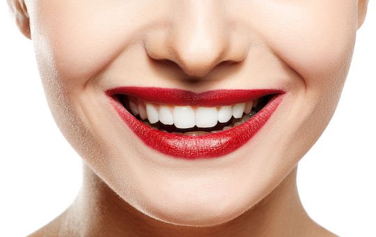 Woman smile. Teeth whitening. Dental care.