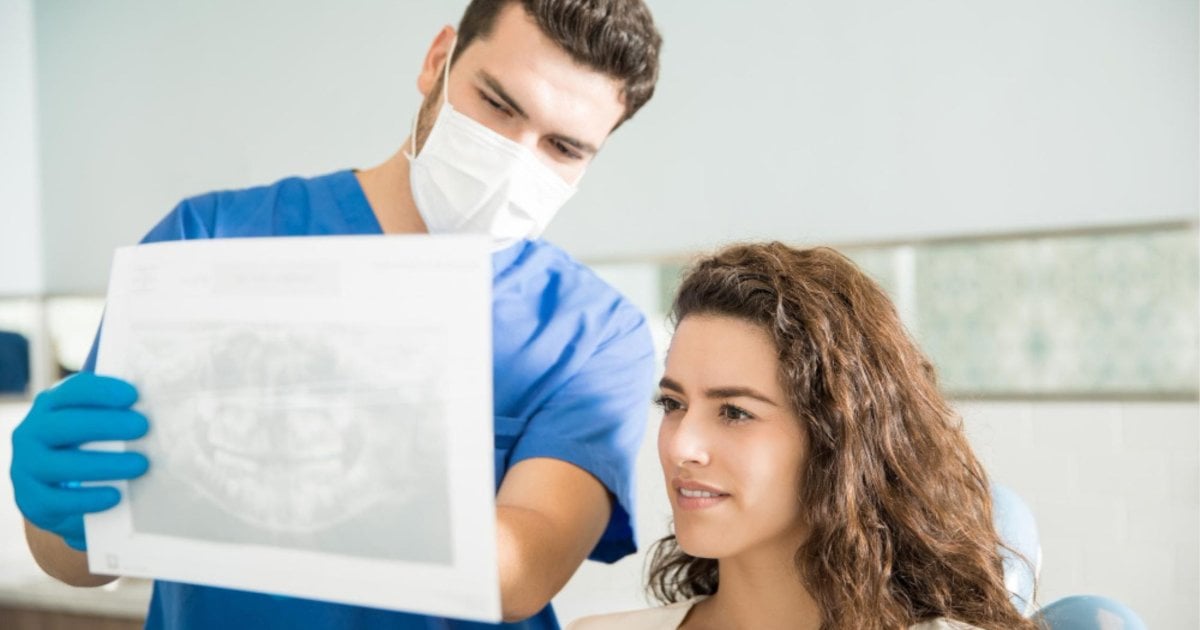 Dentist reviewing an X-ray before root canal treatment in Leederville