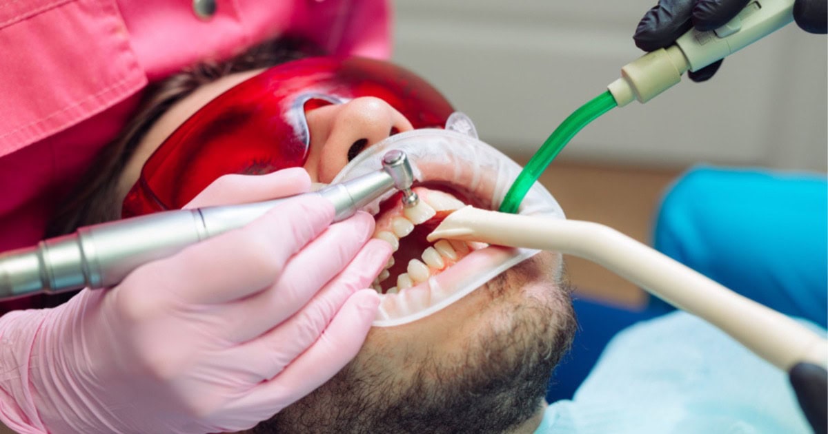 dentist performing a professional scale and clean in Leederville